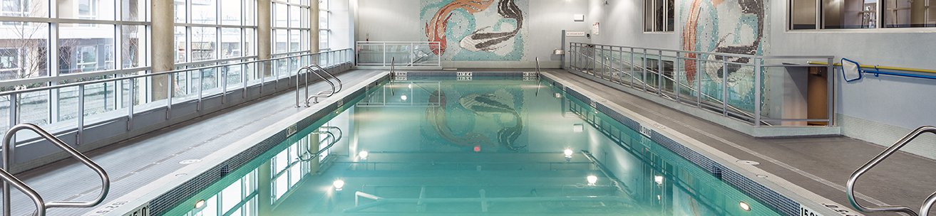 indoor pool with hot tub at level richmond furnished suites